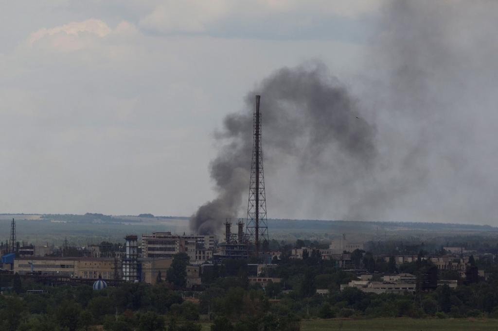 Smoke rises after a military strike on a compound of Sievierodonetsk's Azot Chemical Plant, as Russia's attack on Ukraine continues, in Lysychansk, Luhansk region, Ukraine June 18, 2022.