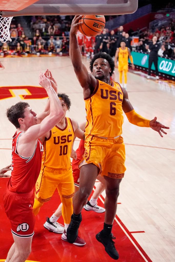 USC guard Bronny James, right, shoots as Utah forward Ben Carlson defends during the second half of a game on Feb. 15, 2024, in Los Angeles.  