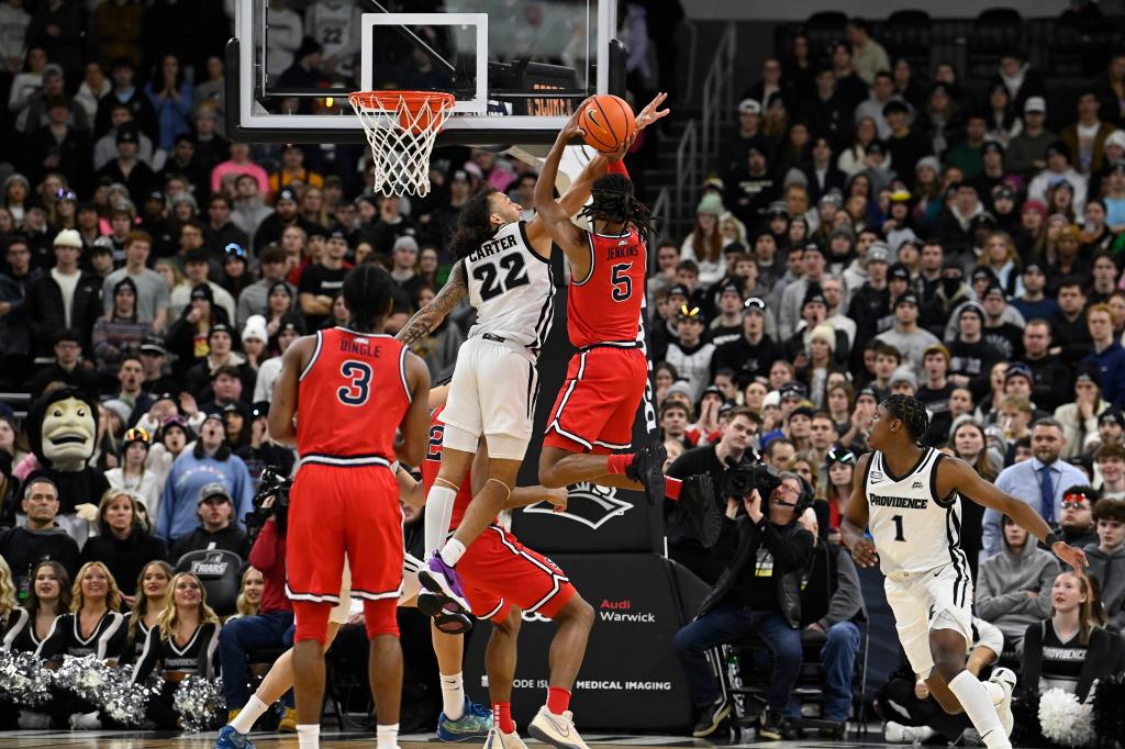  Red Storm guard Daniss Jenkins (5) shoots through Providence Friars guard Devin Carter