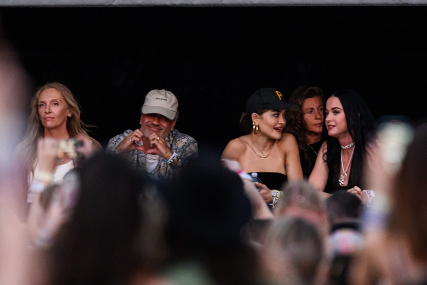 Toni Collette, Taika Waititi, Rita Ora and Katy Perry sitting in front of a crowd at Taylor Swift 'The Eras Tour' in Sydney, Australia