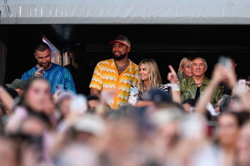 Travis Kelce and Baz Luhrman stand in front of a crowd during Taylor Swift's "The Eras Tour" at Accor Stadium in Sydney, Australia.