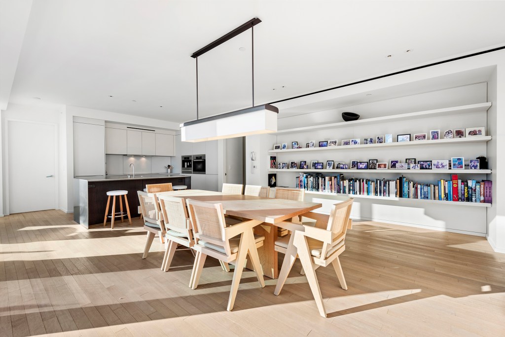 The dining area with built-in bookshelves.