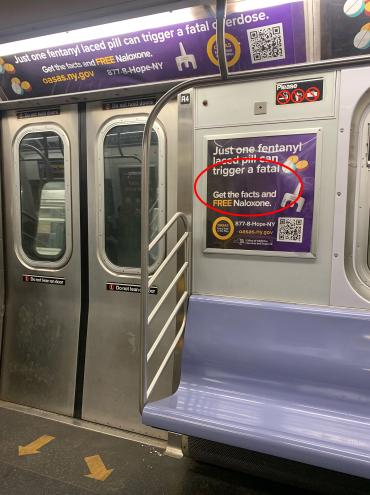 Subway car containing an error-riddled sign warning of dangers of fentanyl but missing the word "overdose."