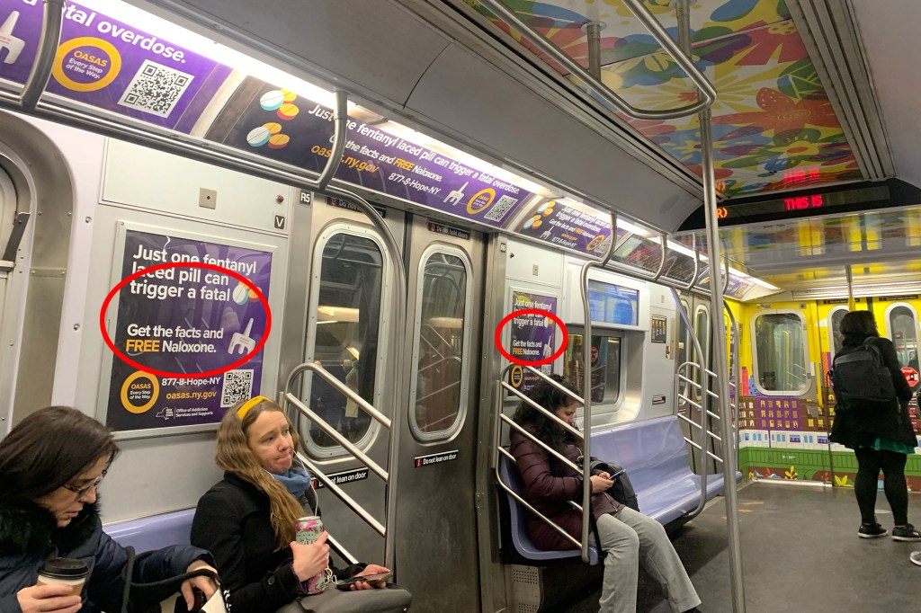 Subway car with an error-riddled signs warning of dangers of fentanyl but missing the word "overdose."