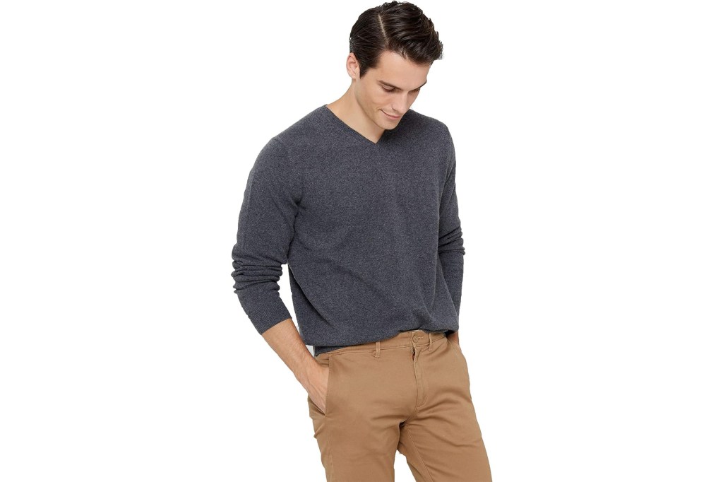 A man wearing a grey sweater.
