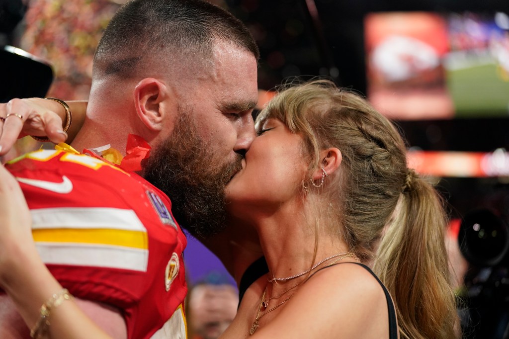 Travis Kelce and Taylor Swift kiss after Chiefs' Super Bowl 2024 win.