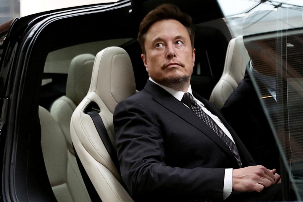 Tesla CEO Elon Musk sits in a Tesla car outside a Beijing hotel on May 31, 2023.