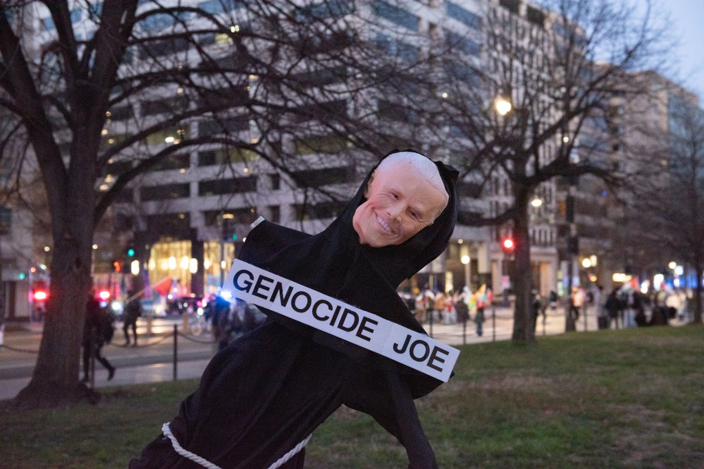 Sign saying "genocide Joe"