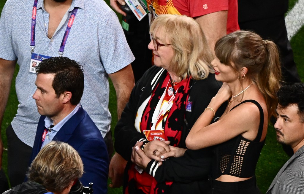 Taylor Swift and Donna Kelce stand on the field after Super Bowl LVIII between the Kansas City Chiefs and the San Francisco 49ers at Allegiant Stadium in Las Vegas, Nevada, February 11, 2024. 