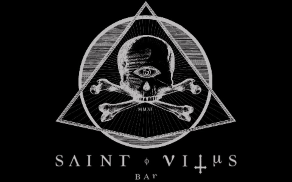 St. Vitus Brooklyn logo with skull and crossbones inside a triangle with Saint Vitus Bar written below 