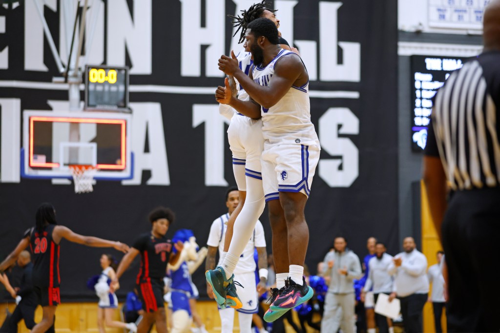 Dylan Addae-Wusu #0 of the Seton Hall Pirates celebrates his dunk at the buzzer with Dre Davis #14 against the UNLV Rebels 