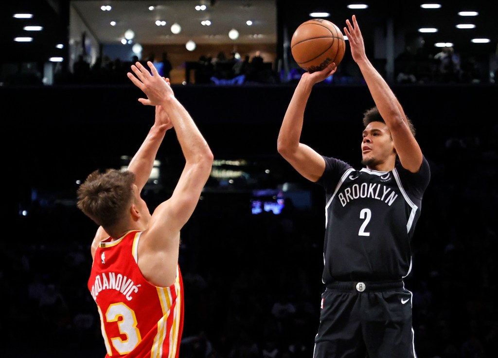 Cameron Johnson #2 of the Brooklyn Nets puts up a shot as Bogdan Bogdanovic #13 of the Atlanta Hawks jumps to defend