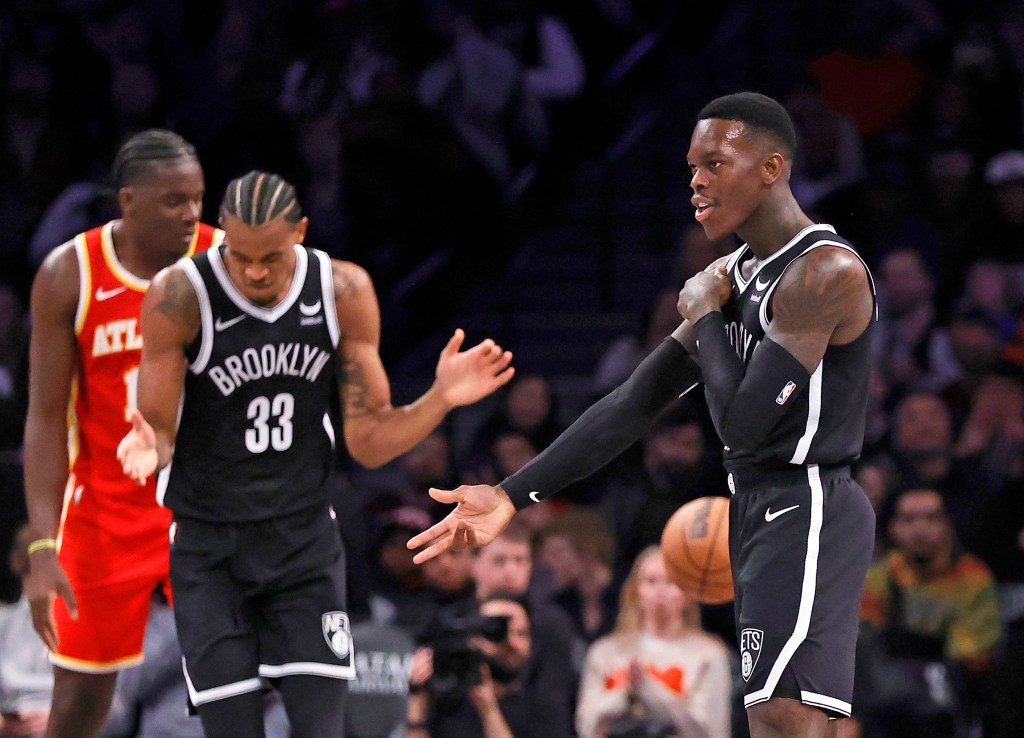 Dennis Schroder #17 of the Brooklyn Nets reacts after hitting a 3-point shot