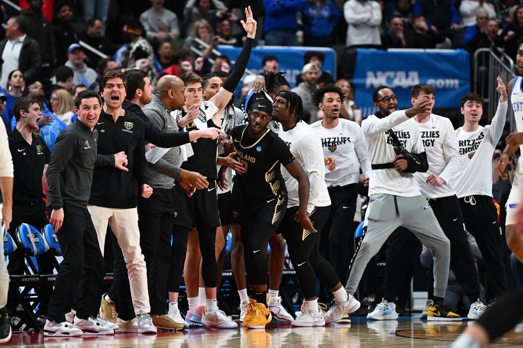 DQ Cole #10 of the Oakland Golden Grizzlies reacts after scoring a three pointer against the Kentucky Wildcats during the second half in the first round of the NCAA Men's Basketball Tournament at PPG PAINTS Arena on March 21, 2024.