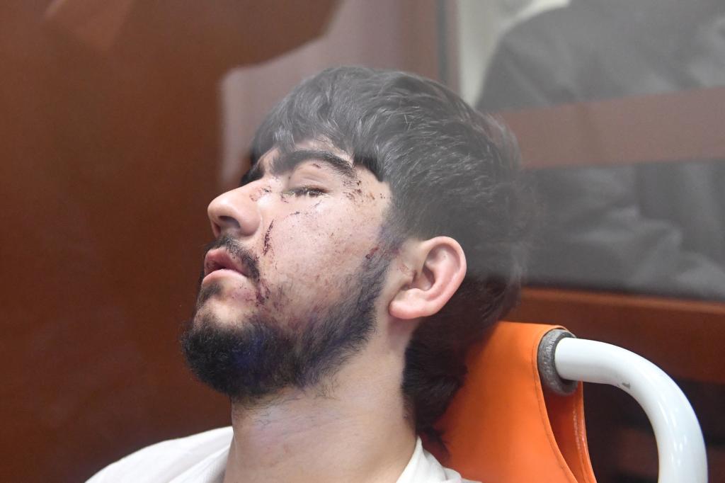 A man suspected of taking part in the attack of a concert hall that killed 137 people, the deadliest attack in Europe to have been claimed by the Islamic State jihadist group, sits inside the defendant cage as he waits for his pre-trial detention hearing at the Basmanny District Court in Moscow on March 25, 2024. 