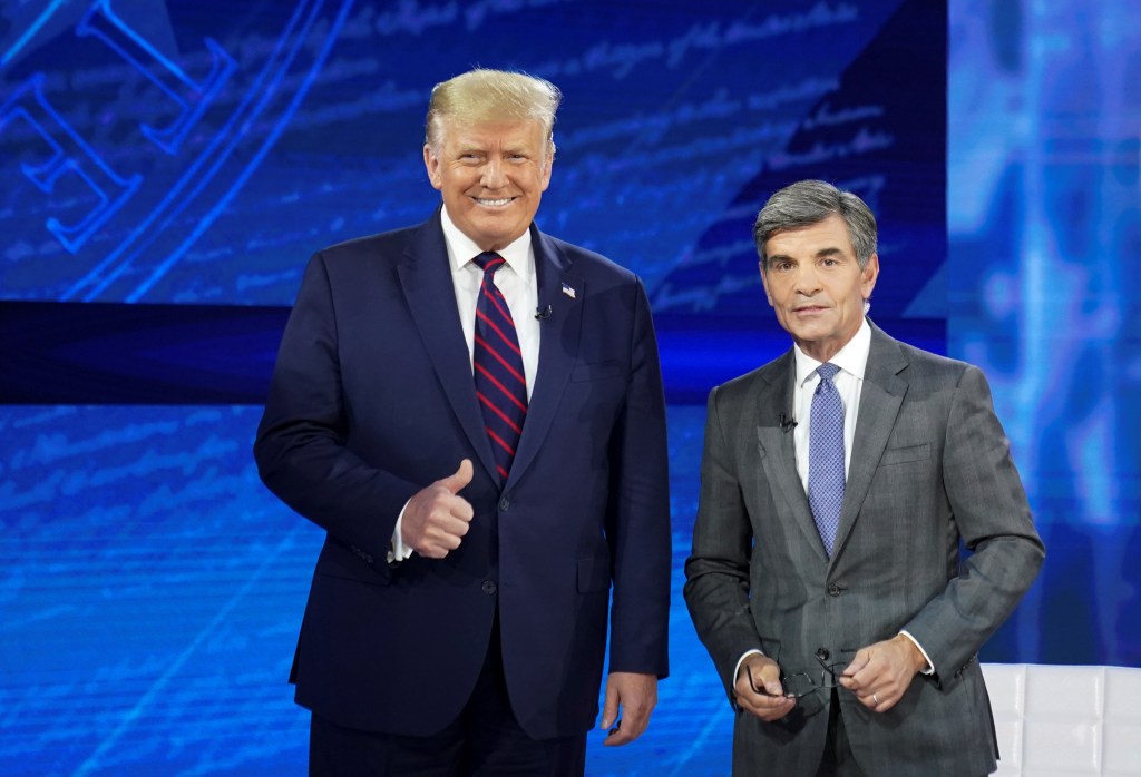 Donald Trump poses with  George Stephanopoulos for a town hall event in Philadelphia, Pennsylvania on Sept. 15, 2020.