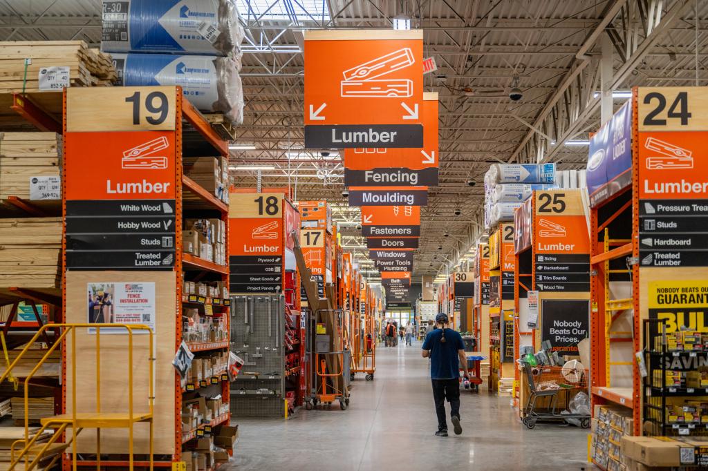 Customer walking through a Home Depot store in Austin, Texas in February 2024, following the company's positive earnings report and announcement of the SRS Distribution acquisition