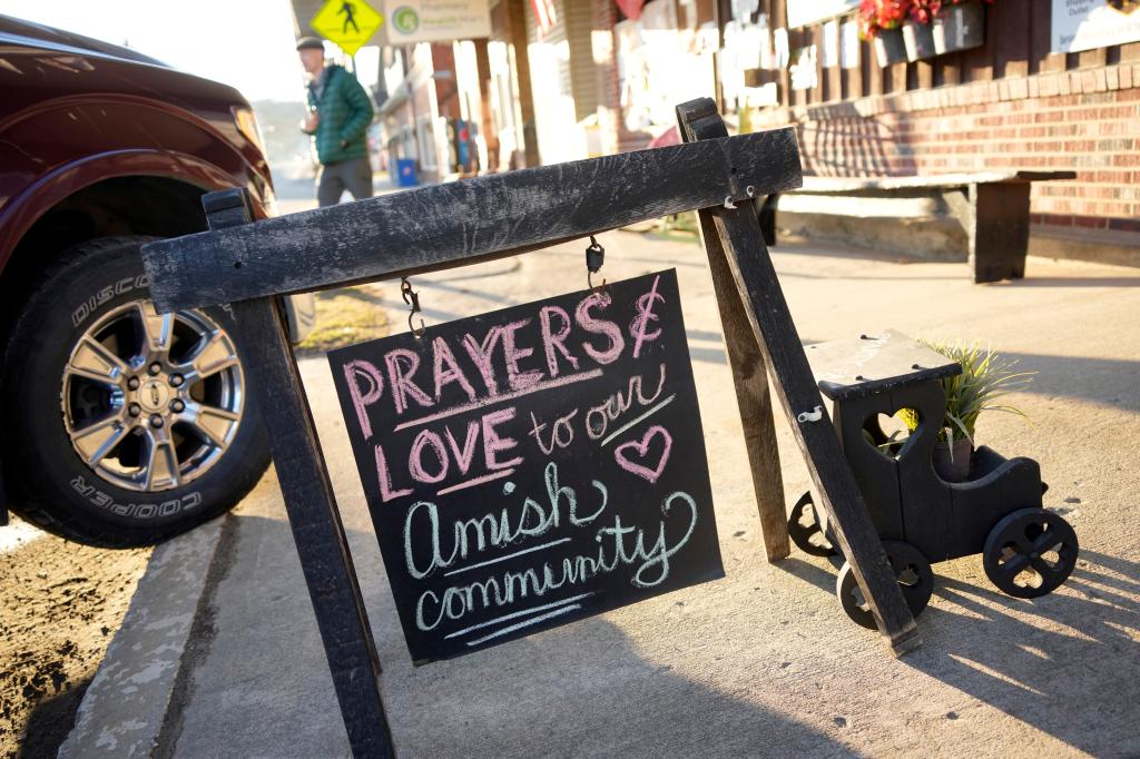 A sign on the sidewalk outside an antique store in Spartansburg, Pa.