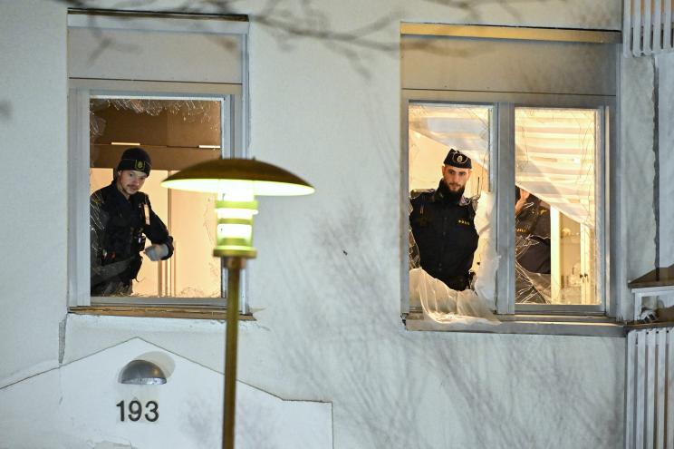 Swedish police officers work inside an apartment after an explosion where a man who was recently arrested in the investigation of a murder and 2 attempted murders related to the Foxtrot conflict.