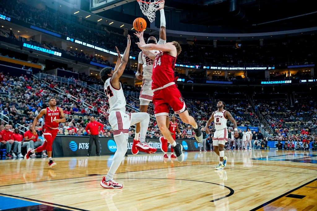 North Carolina State Wolfpack forward Ben Middlebrooks (34) attempts to dunk the ball in the first round of the 2024 NCAA Tournament at PPG Paints Arena. 