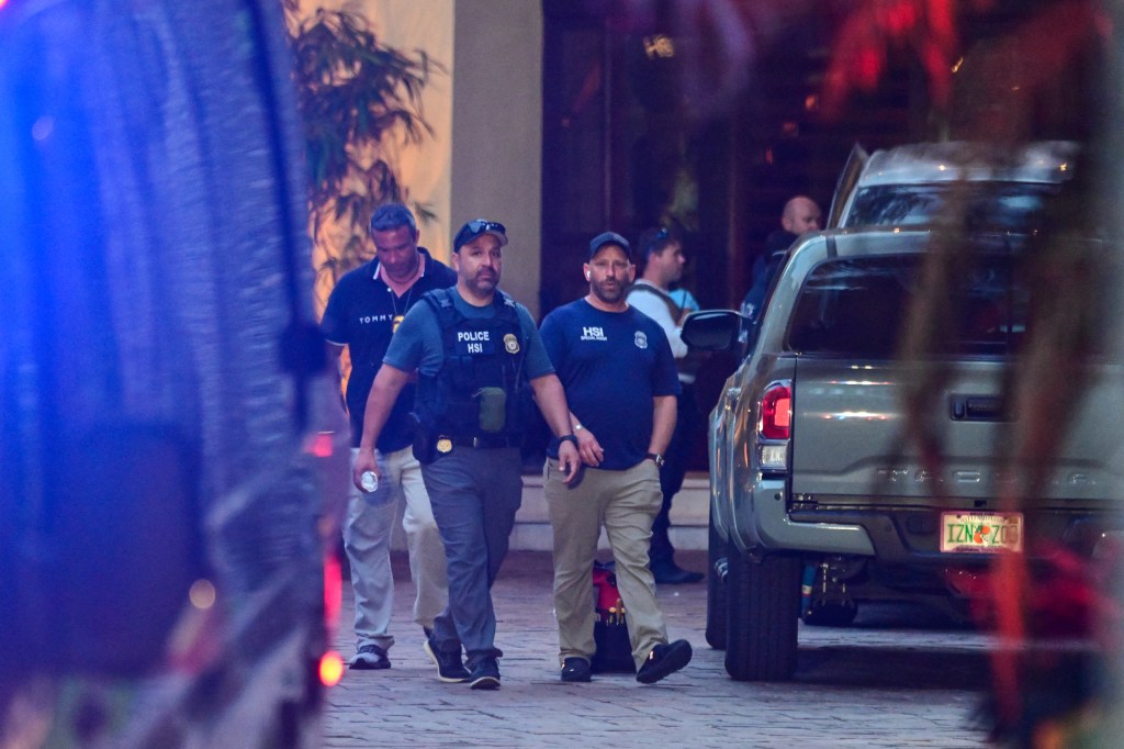 Homeland Security Investigation agents are seen at the entrance of US producer and musician Sean "Diddy" Combs's home at Star Island in Miami Beach on March 25, 2024. 