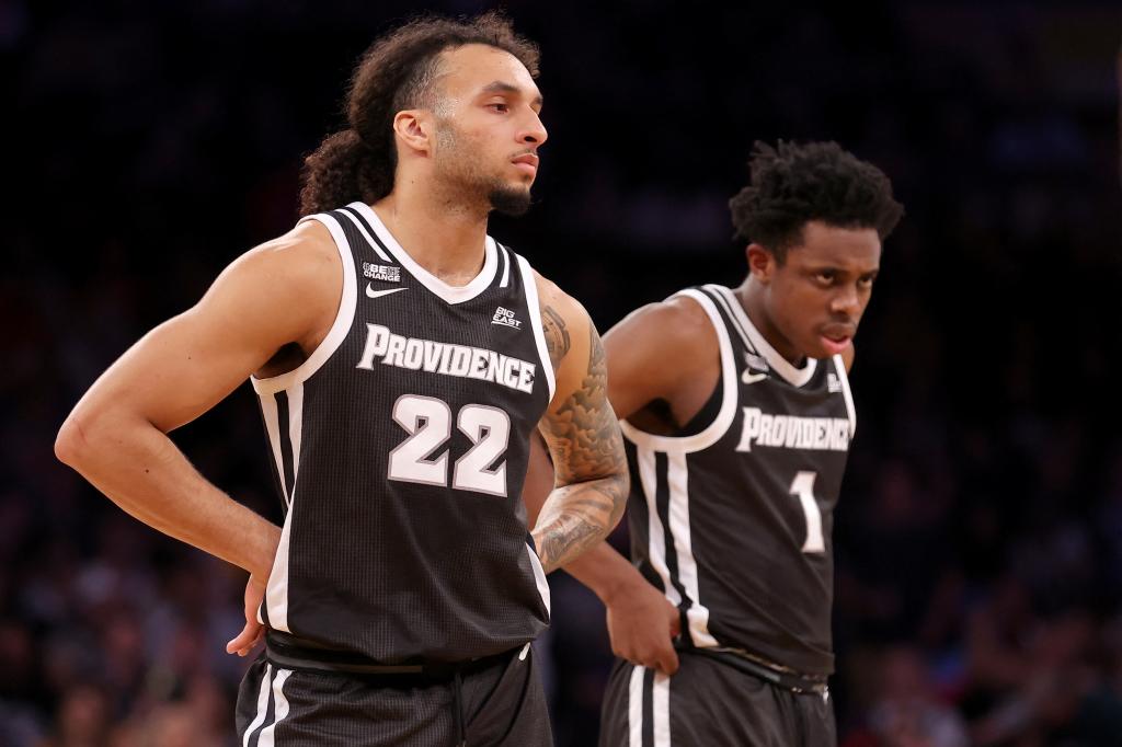 Providence Friars guards Devin Carter (22) and Jayden Pierre (1) react during the first half against the Marquette Golden Eagles at Madison Square Garden.