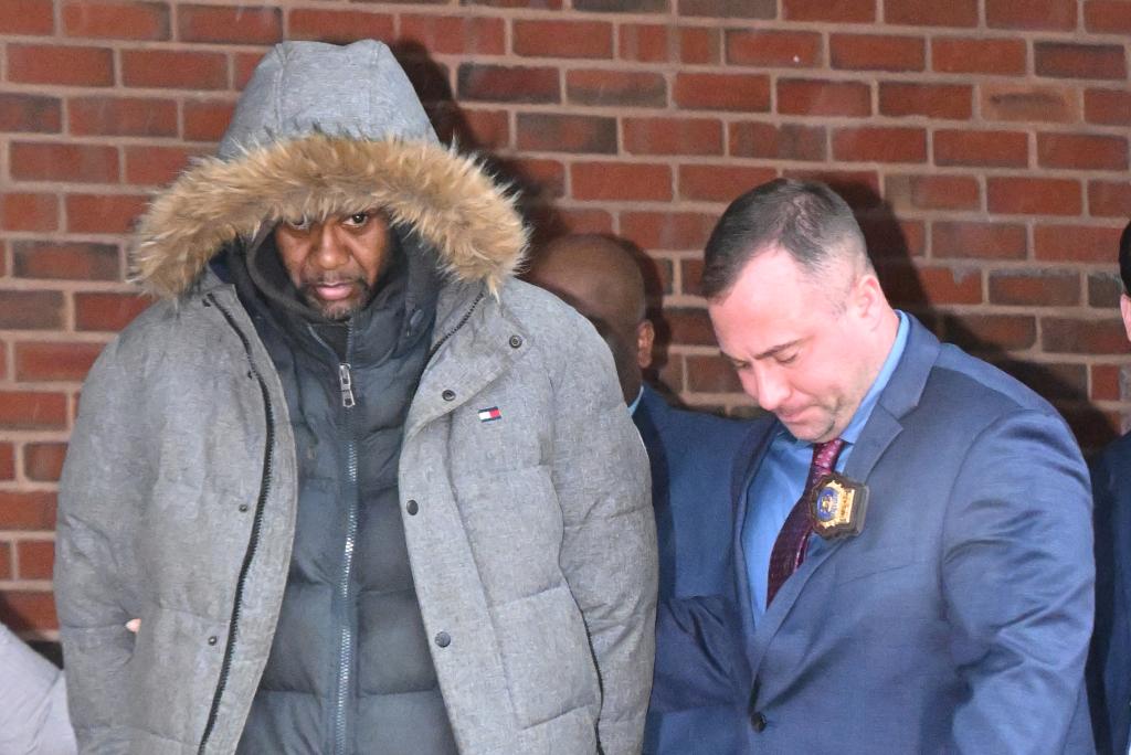 Milton Hamlin, 46, seen in cuffs during his Manhattan perp walk.