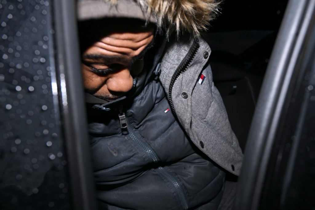 Milton Hamlin, 46, seen in cuffs during his Manhattan perp walk.