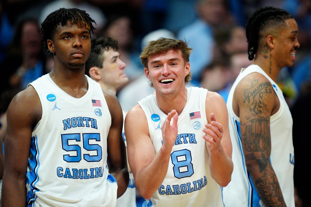 Paxson Wojcik #8 of the North Carolina Tar Heels celebrates as Harrison Ingram #55 looks on against the Wagner Seahawks during the second half in the first round of the NCAA Men's Basketball Tournament at Spectrum Center on March 21, 2024 in Charlotte, North Carolina.  