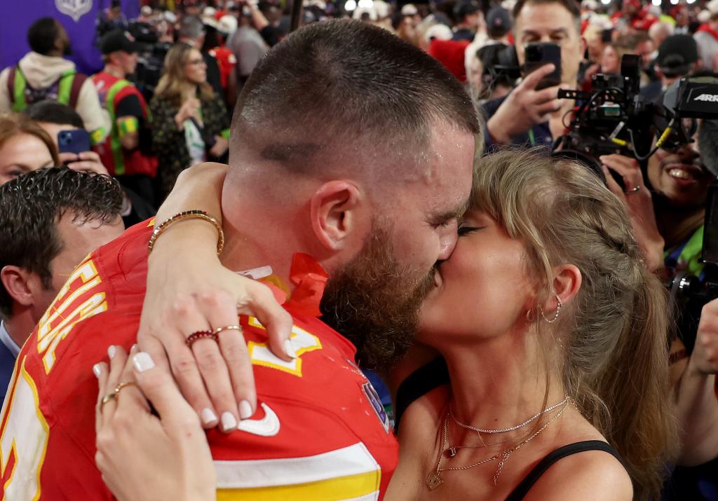 Travis Kelce and Taylor Swift celebrated the Chiefs' Super Bowl 2024 win with a kiss at Allegiant Stadium in February 2024.