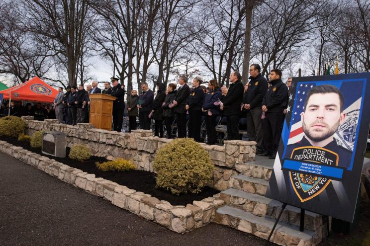 People gathered at a vigil for slain NYPD Officer Jonathan Diller in Massapequa Park on March 27, 2024.