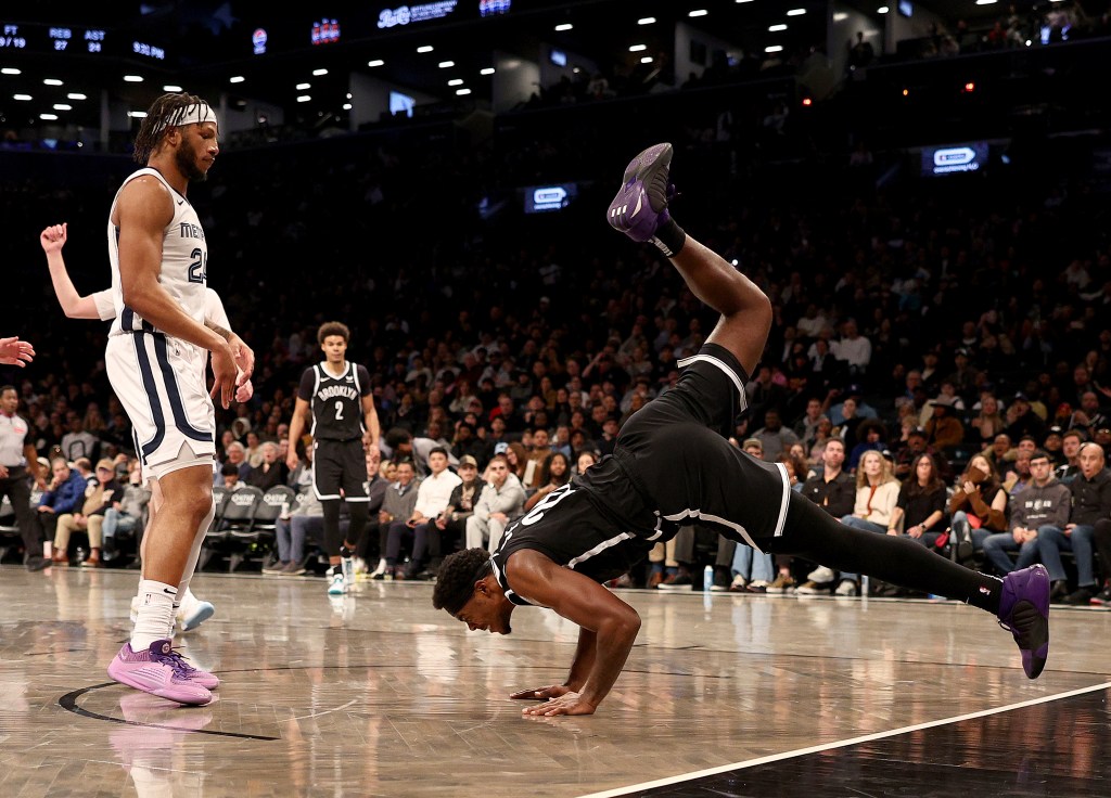 Day'Ron Sharpe falls after he is fouled during the second half against the Grizzlies.