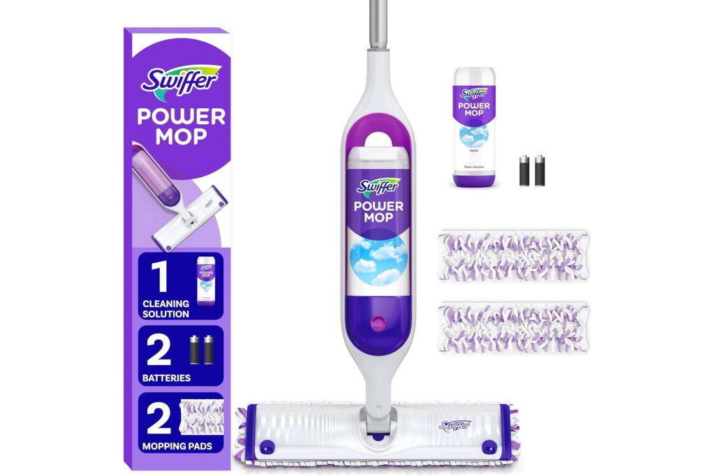 A mop next to cleaning pads and a solution for cleaning.