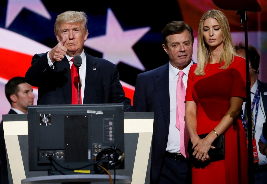 Donald Trump makes a thumbs up gesture as Paul Manafort and Ivanka Trump watch during the Republican National Convention walk through in Cleveland.