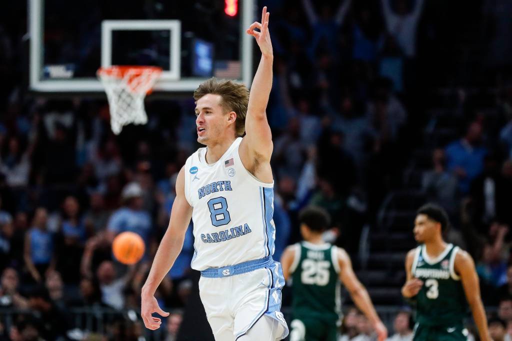 North Carolina guard Paxson Wojcik (8) celebrates a play against Michigan State during the first half of the NCAA tournament West Region second round at Spectrum Center in Charlotte, N.C. on Saturday, March 23, 2024.
