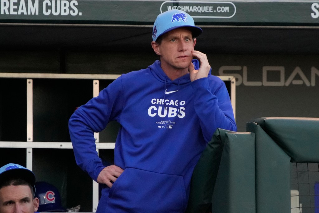 Cubs manager Craig Counsell watches from the dugout against the Milwaukee Brewers in the first inning at Sloan Park.