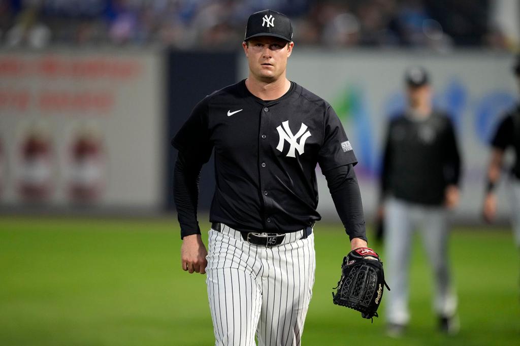 New York Yankees starting pitcher Gerrit Cole walks to the field before a spring training baseball game against the Toronto Blue Jays Friday, March 1, 2024, in Tampa, Fla.