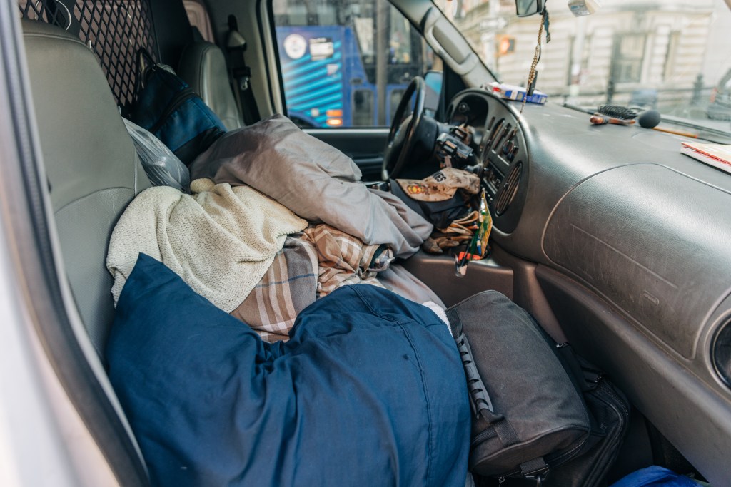 The inside of Rossi's van, where he sleeps to protect his spot outside the Met. 