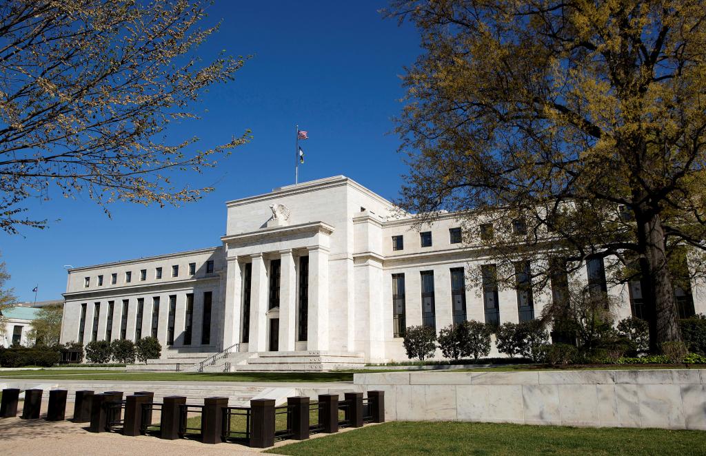 The Federal Reserve Building in Washington - a white building with a flag on top.