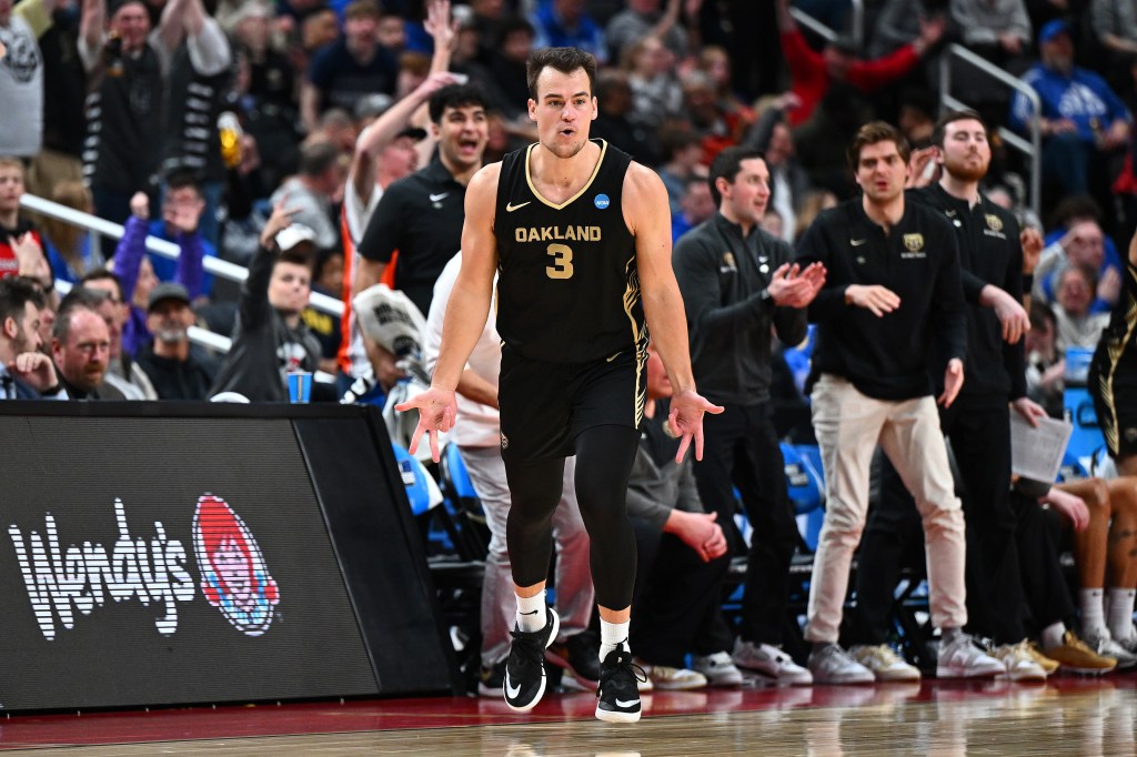 Jack Gohlke #3 of the Oakland Golden Grizzlies reacts after making a three pointer against the Kentucky Wildcats during the second half in the first round of the NCAA Men's Basketball Tournament at PPG PAINTS Arena on March 21, 2024 in Pittsburgh, Pennsylvania.  