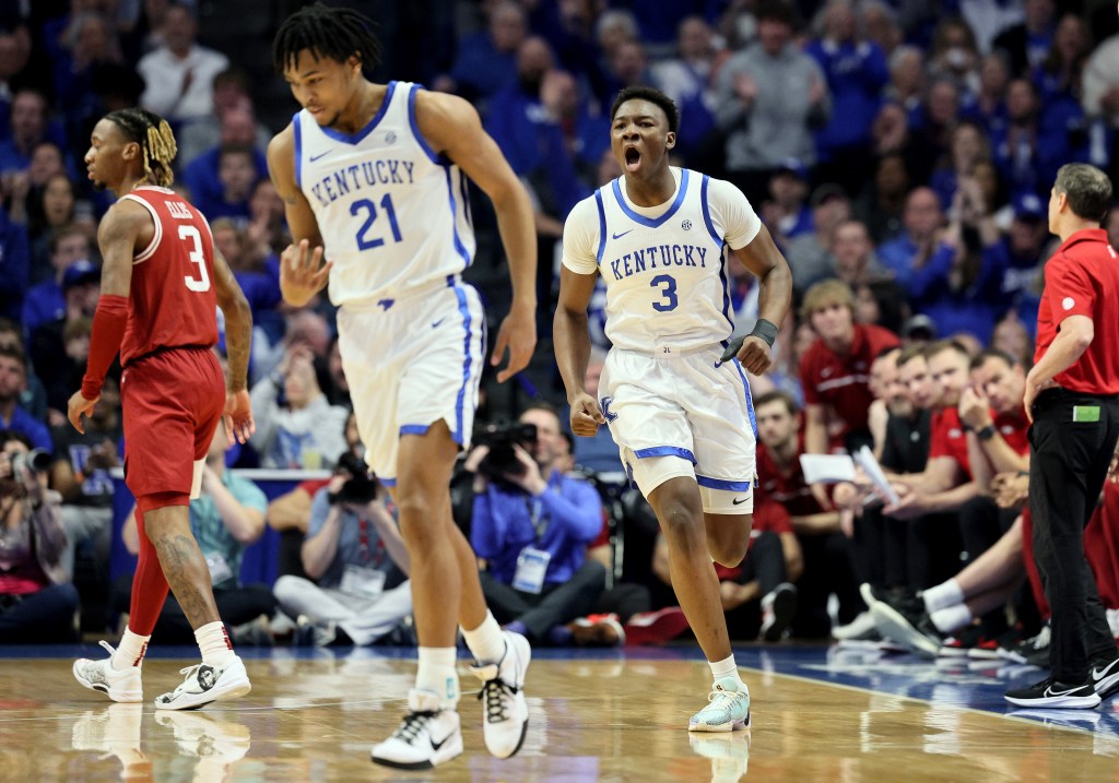 Adou Thiero #3 of the Kentucky Wildcats celebrates after D.J. Wagner #21 made a three point shot in the first half against the Arkansas Razorbacks.