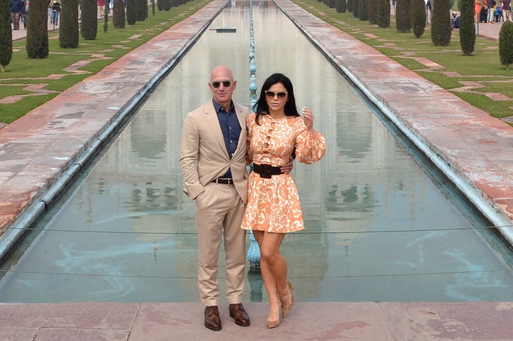 Jeff Bezos and Lauren Sanchez posing for a picture at the Taj Mahal in Agra.