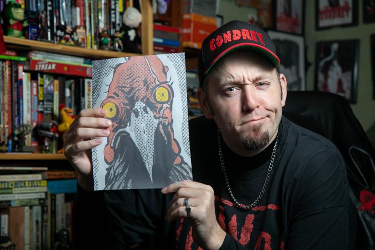 Author Patrick Hickey Jr. poses with his comic book, "Midland Beach Ninja Turkeys"