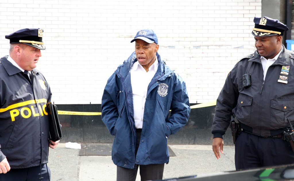 Mayor Adams speaks with two officers