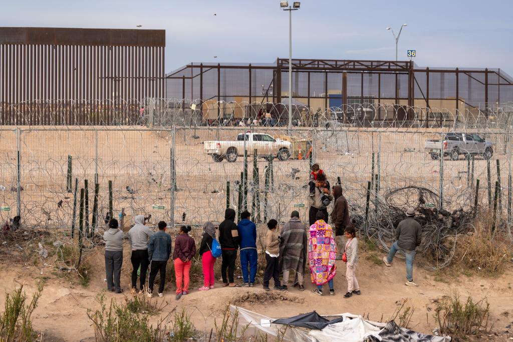 Migrants are pictured at the El Paso border crossing on March 20.