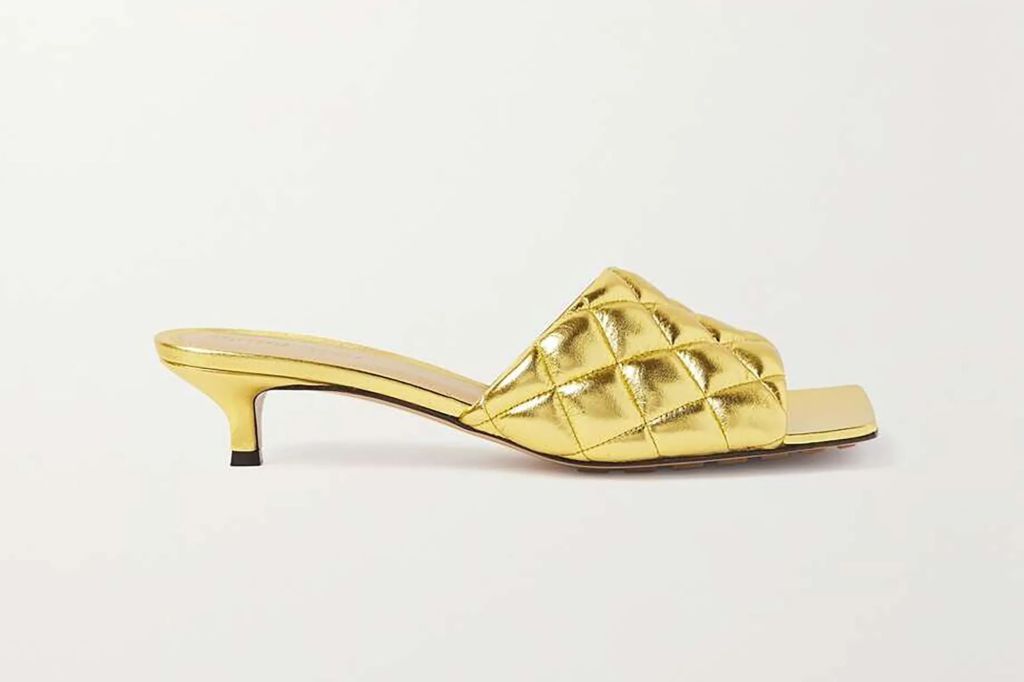 An image of gold Bottega mules