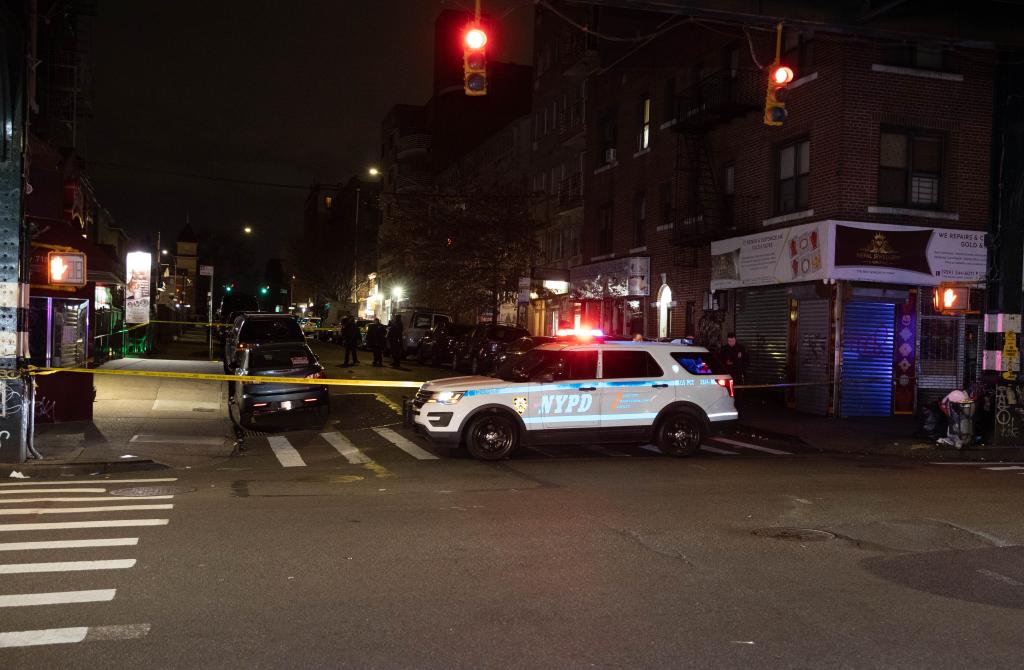 A cop car sits near the bar where the fighting happened.