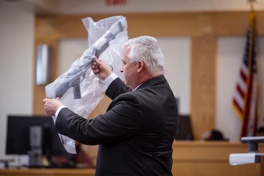 Prosecutor David Waymire shows the jury a AK-47 allegedly found in Muhammad Syed's possession, during opening statements in the trial of Syed at the Bernalillo County Courthouse in Downtown Albuquerque, N.M,, on Tuesday, March 12, 2024