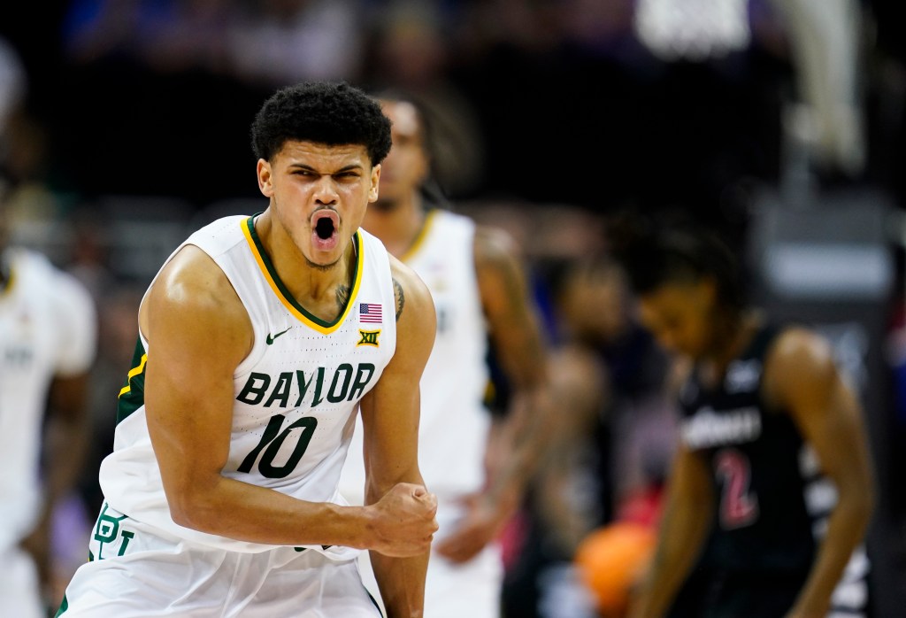 RayJ Dennis #10 of the Baylor Bears celebrates after scoring during the second half of a quarterfinal game of the Big 12 Men's Basketball Tournament against the Cincinnati Bearcats.