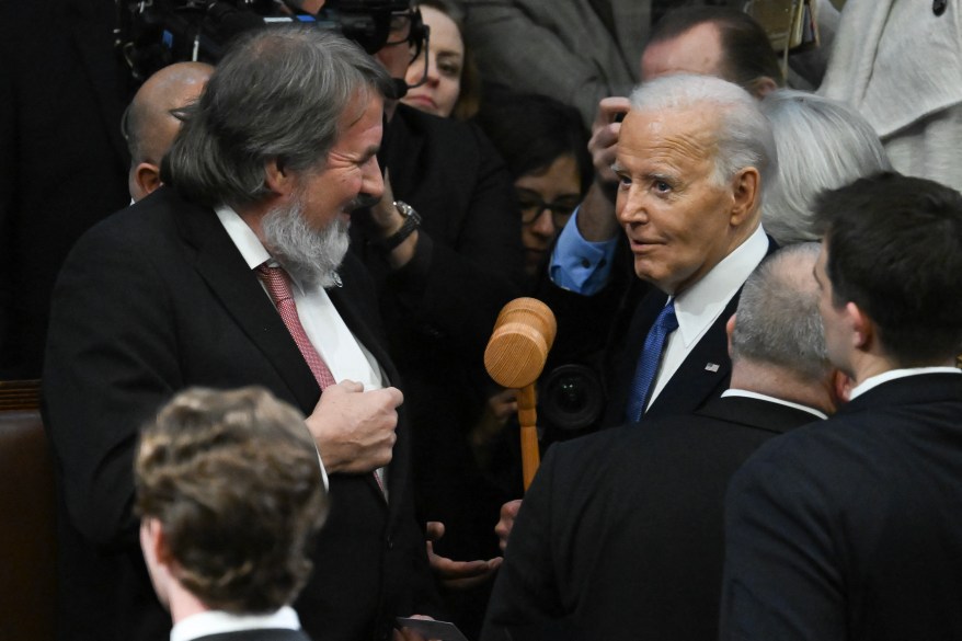 Joe Biden receives a gavel from Doug LaMalfa.